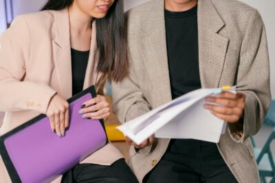 Business meeting with professionals reviewing documents in an indoor office setting.