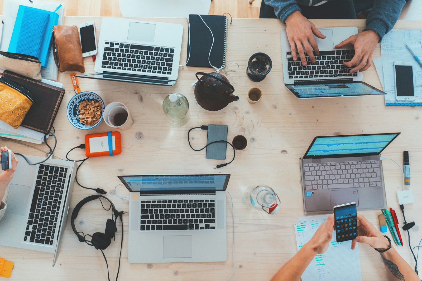 WordPress media library showing a selected image of a team working around a desk with laptops, representing digital collaboration and AI Assisted Quoting.
